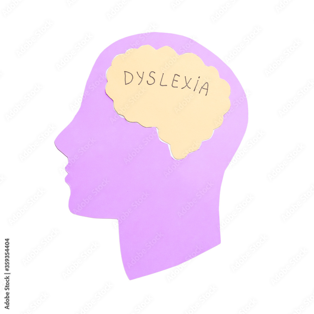 Paper human head with word DYSLEXIA on white background