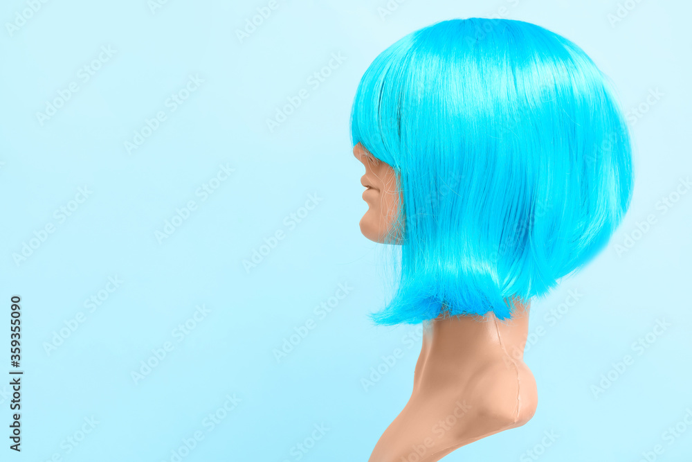 Mannequin with unusual female wig on color background Stock Photo