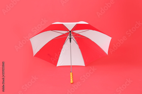 Red and white open umbrella...