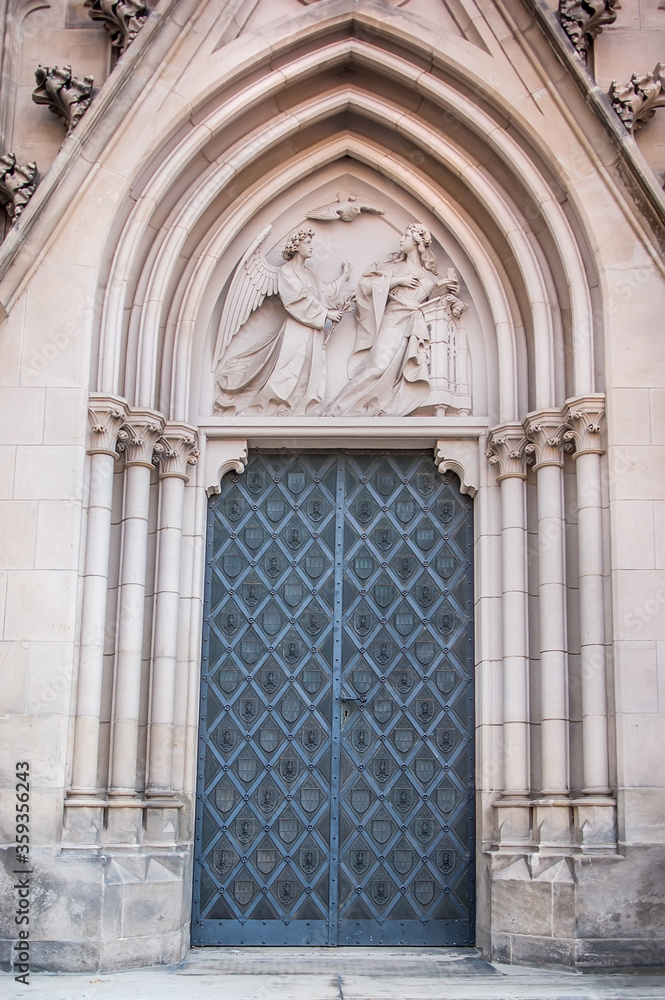 Old church textured door with stone arch facade