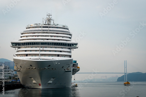 NAGASAKI, Japan. Large white ship at the port. Arrival of Costa Venezia - one of the biggest cruise ships in the world from Shanghai to Nagasaki Port.