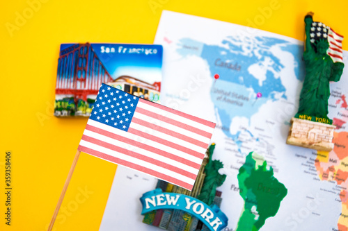 Usa flag and magnets from new york and san francisco over world map with pins