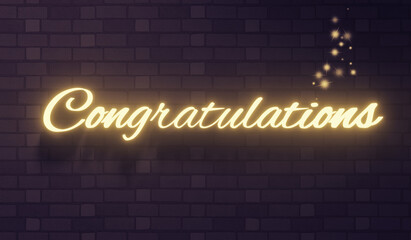 The word congratulations on a brick wall