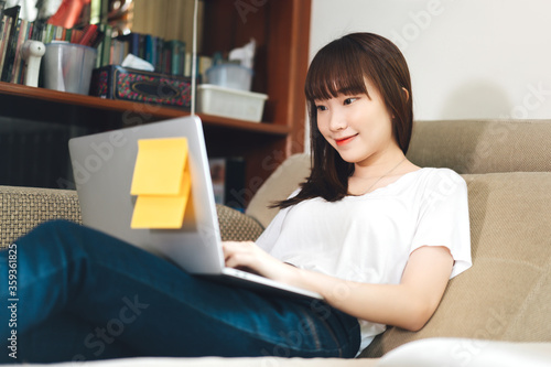 College student study online stay at home via internet in living room