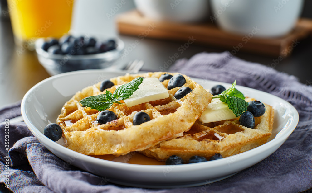 blueberry waffles with mint garnish blueberry waffles with mint garnish