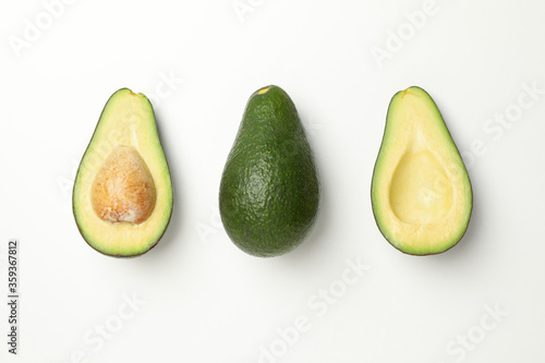Flat lay with avocado on white background, top view