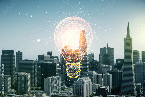 Double exposure of creative light bulb hologram on San Francisco city skyscrapers background, research and development concept