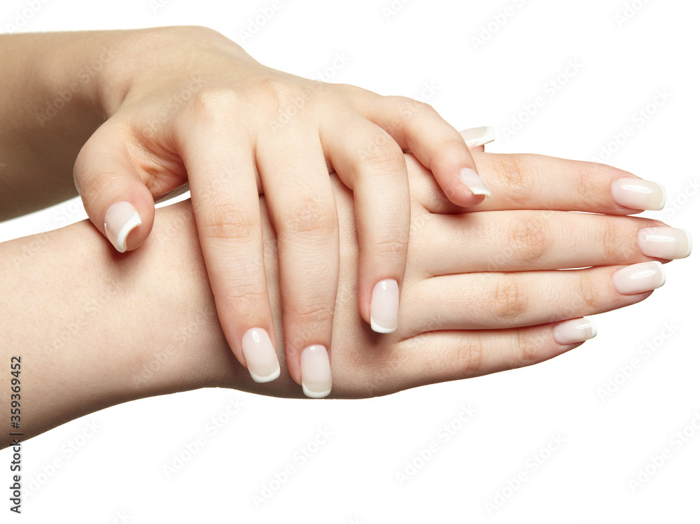 Fototapeta Kobiece dłonie z profesjonalnym naturalnym manicure francuskim na białym tle