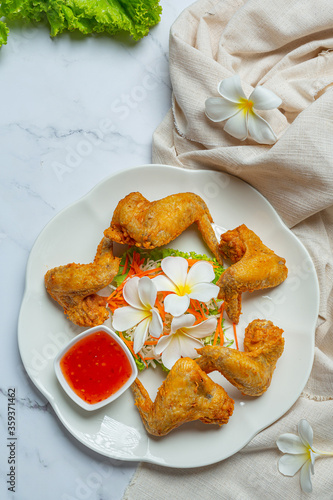 Fried wings with fish sauce, beautifully decorated and served.