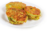 Savory rice fritters with vegetables on dish close-up