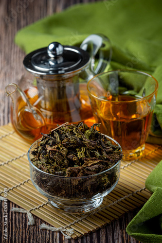 Oolong green tea in a teapot and bowl.