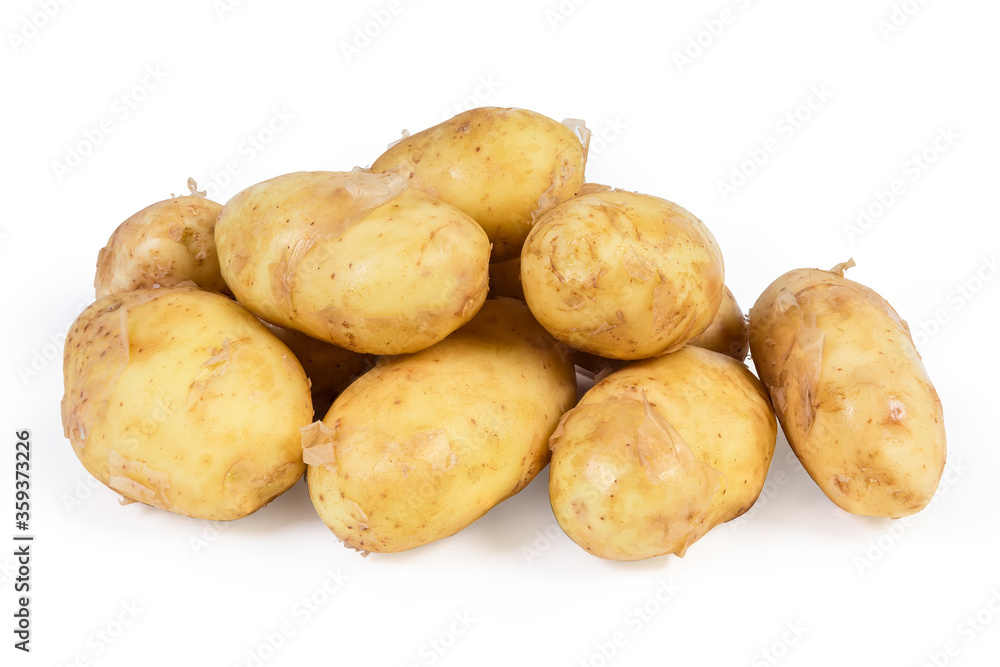 Raw yellow young potatoes with skin on a white background Raw yellow young potatoes with skin on a white background