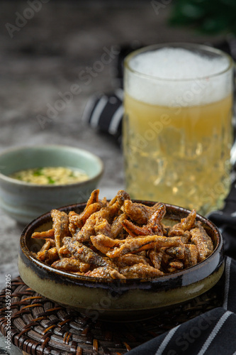 Beer with crispy fish hors d'oeuvres, World Beer Day.