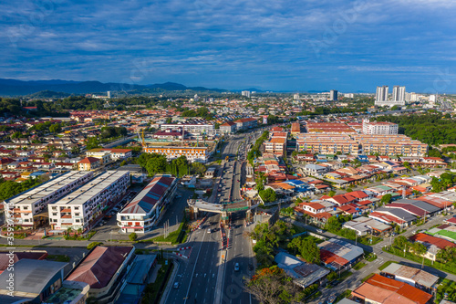 Fototapeta Naklejka Na Ścianę i Meble -  Aerial image of car moving on Kota Kinabalu City, Sabah, Malaysia