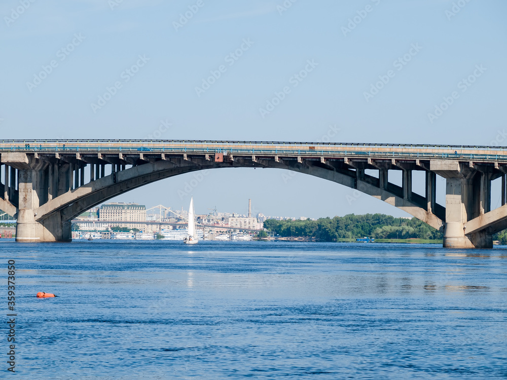 One span of arch concrete bridge over river, Kyiv, Ukraine