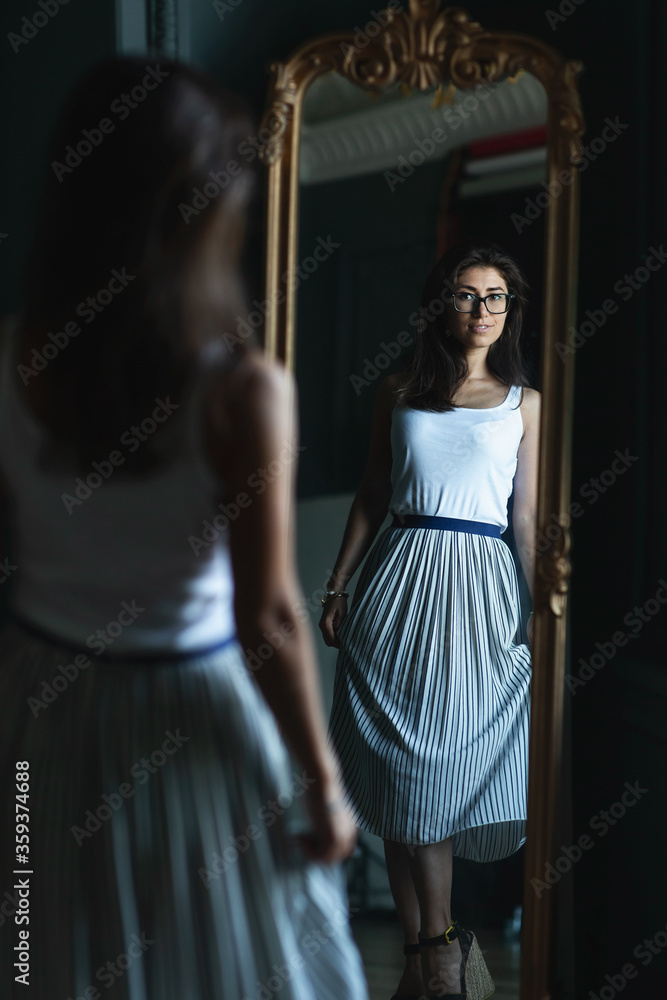 Beautiful smiling young woman with fresh skin of face posing in a room Beautiful smiling young woman with fresh skin of face posing in a room
