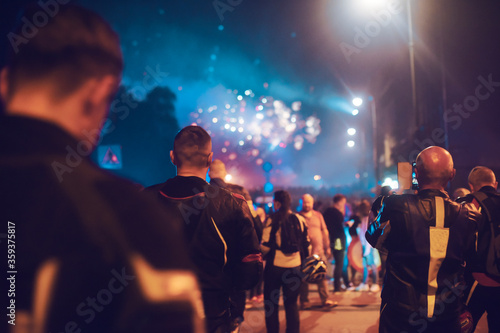 Bikers go to look at the fireworks. Strong men admire beauty. Holiday