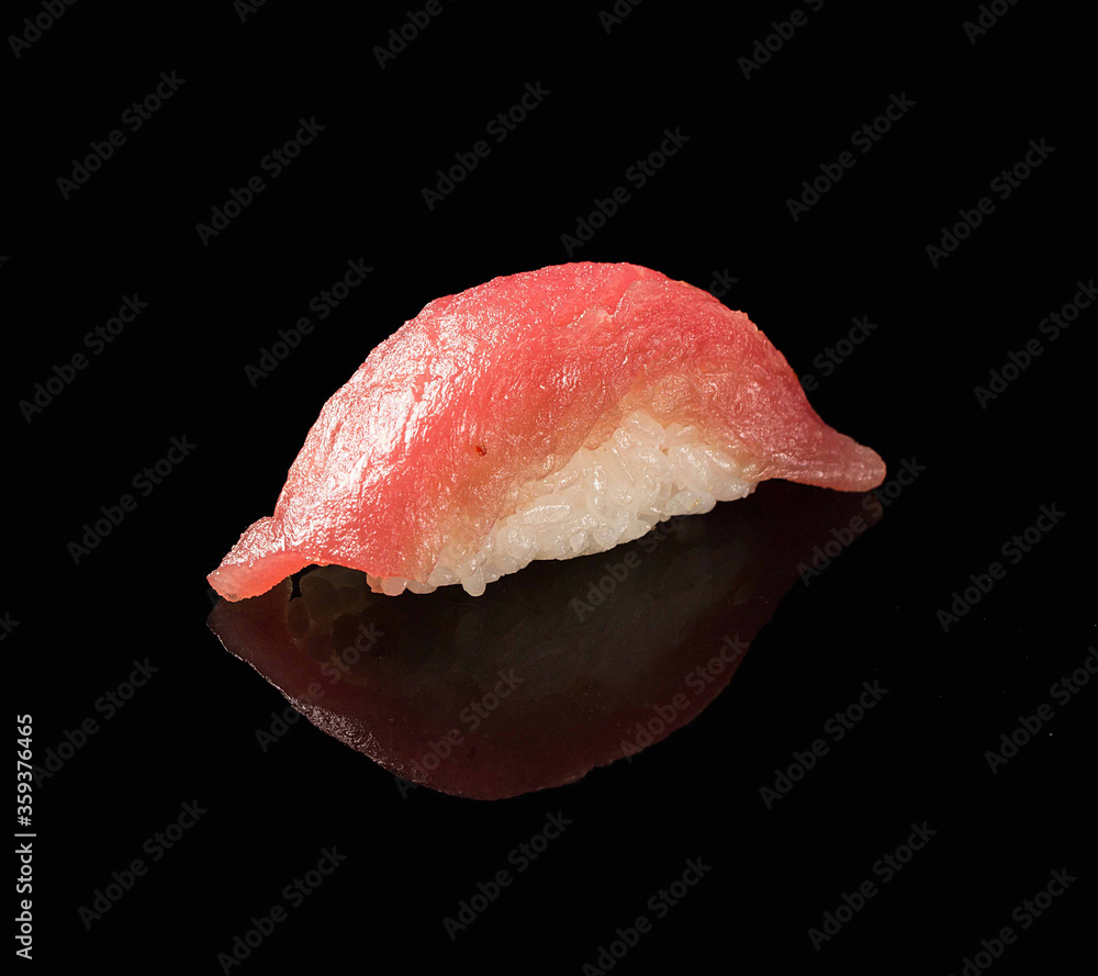 Traditional Japanese dish.Sushi with tuna on black background Traditional Japanese dish.Sushi with tuna on black background