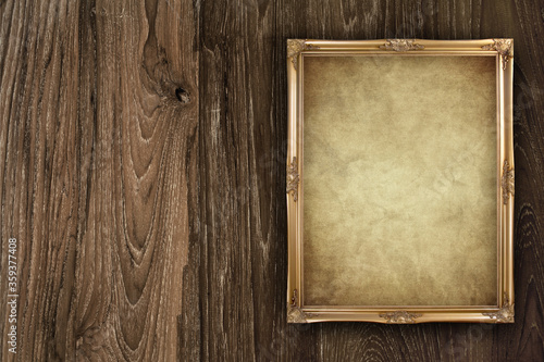 old paper frame on wooden background