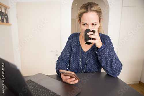 young woman drinking coffee at home
