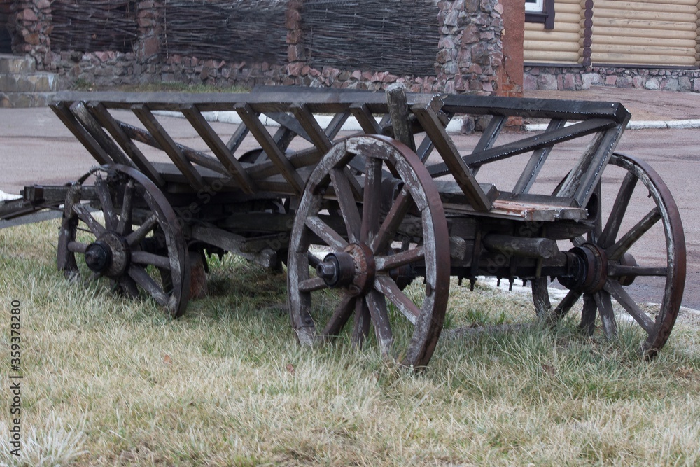 Old wooden carriage on lawn