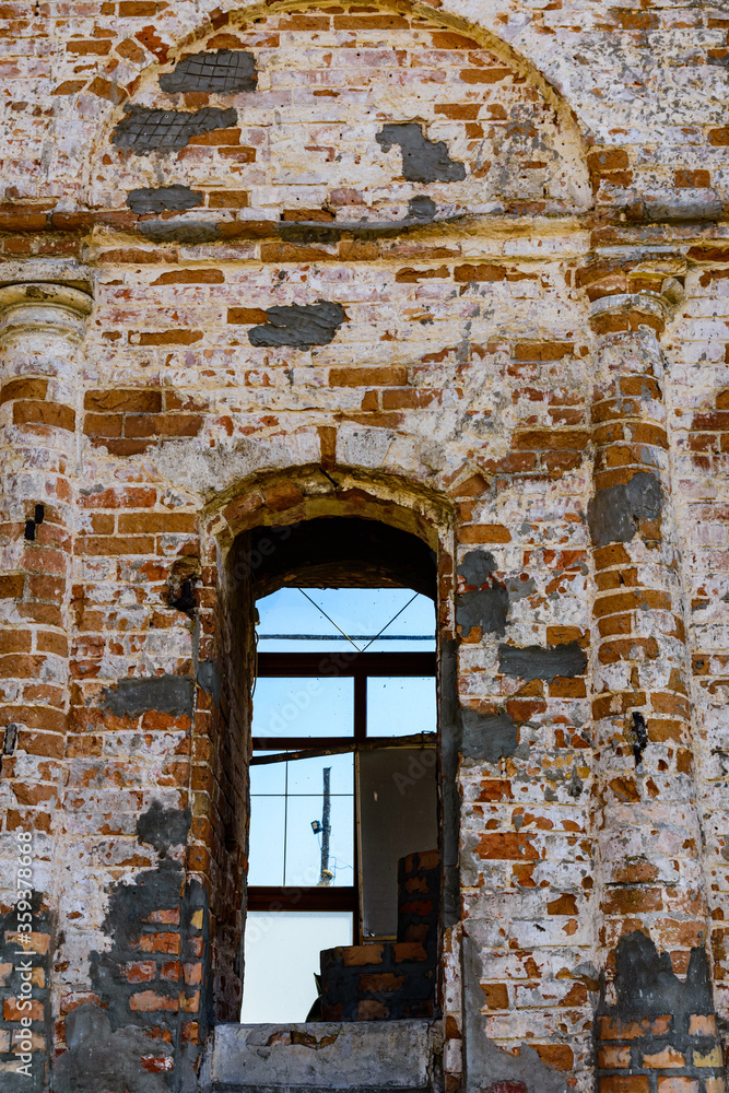 Window hole in the ancient building. Ancient house restoration Window hole in the ancient building. Ancient house restoration