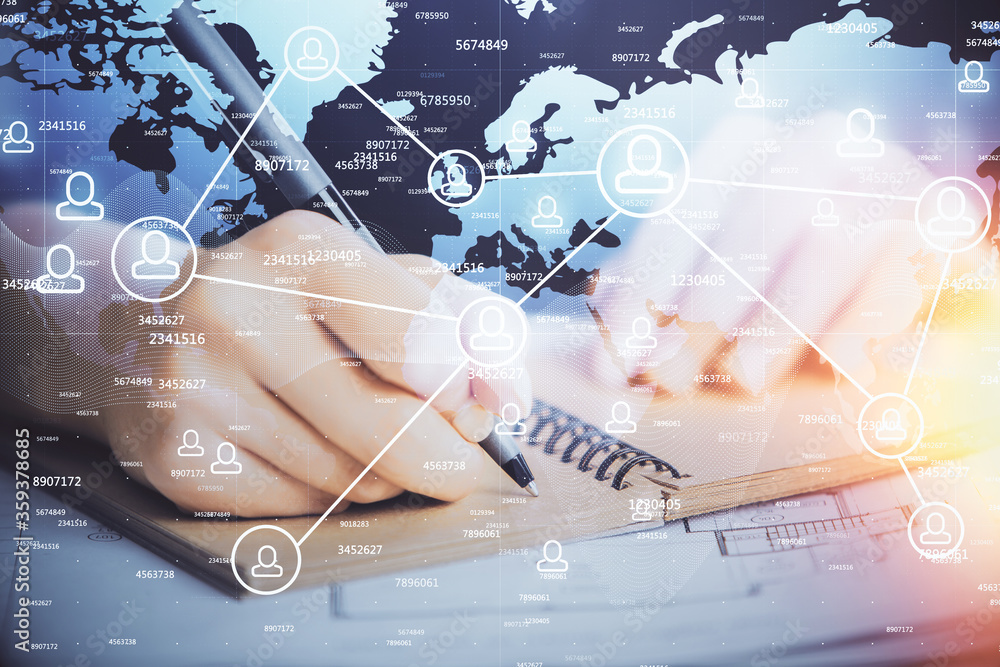 Social network theme hologram over woman's hands writing background. Concept of international people connect. Double exposure Social network theme hologram over woman's hands writing background. Concept of international people connect. Double exposure