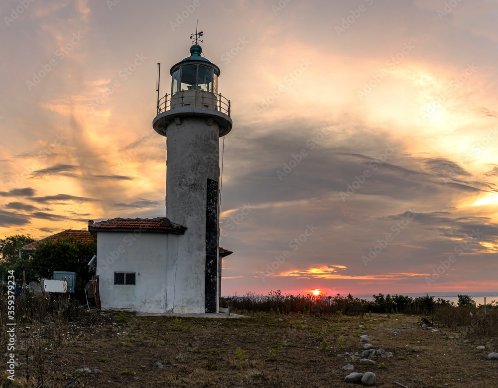 Panorama view of old lighthouse at St. Ivan island, during colorful sunset, located near Sozopol minisipality, Bulgaria.
