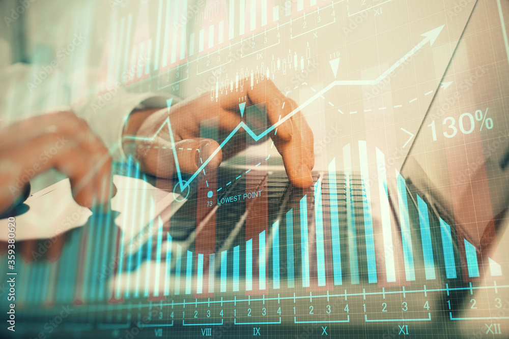 Double exposure of market chart with man working on computer on background. Concept of financial analysis. Double exposure of market chart with man working on computer on background. Concept of financial analysis.