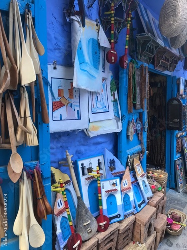 Group of wooden cooking utensils and handcraft moroccan on sale at market in chefchaouen. Morocco © MOUAD