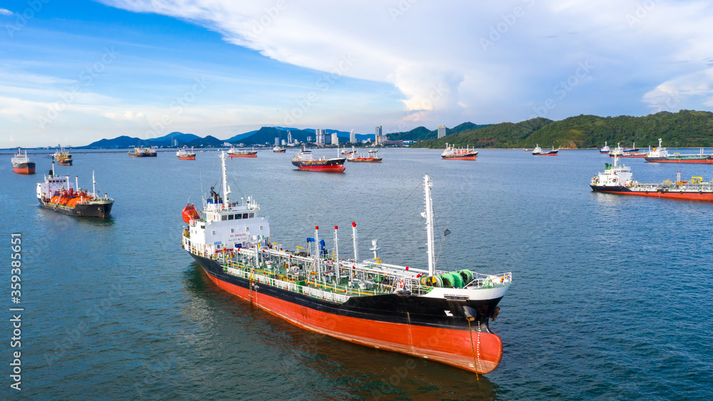 Fototapeta premium Oil tanker and LPG tanker parking at sea oil port terminal, Aerial view oil and gas petrochemical tanker offshore in open sea, Refinery industry cargo ship.