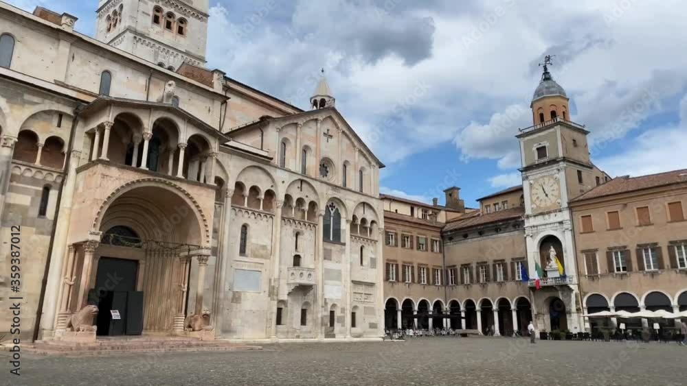 21/06/20, Modena - Hyperlapse of Piazza Grande with Duomo catholic cathedral, Ghirlandina bells tower and city hall. Unesco heritage site. Concept for travel and tourism 21/06/20, Modena - Hyperlapse of Piazza Grande with Duomo catholic cathedral, Ghirlandina bells tower and city hall. Unesco heritage site. Concept for travel and tourism