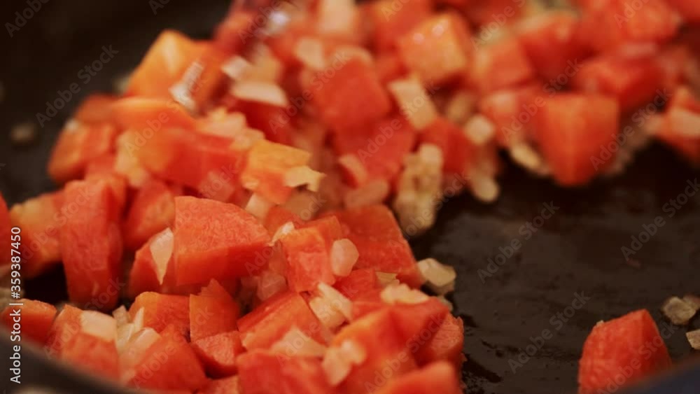 Frying carrots in a pan