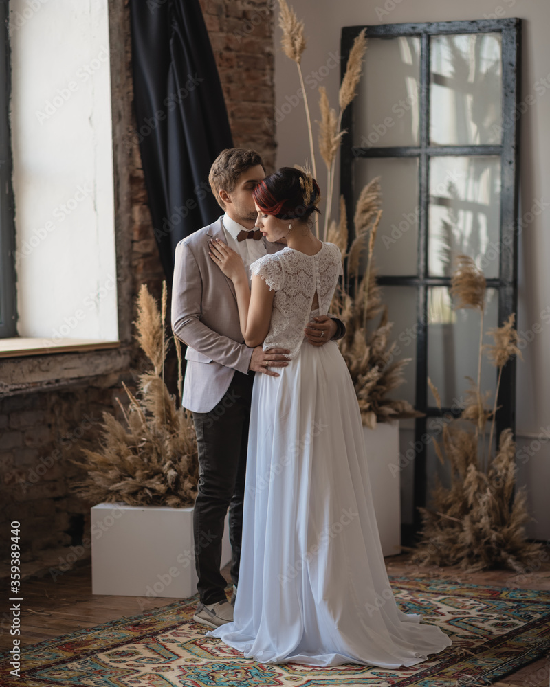 Fototapeta premium the bride and groom are dancing in the background Vintage wall