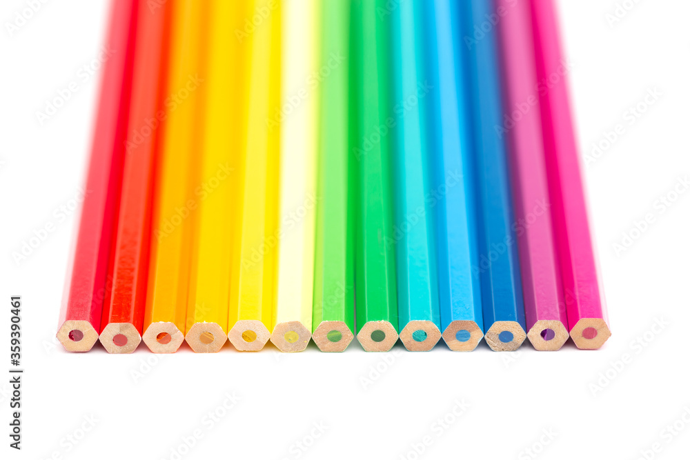 A lot of colorful wooden pencils on a white background A lot of colorful wooden pencils on a white background
