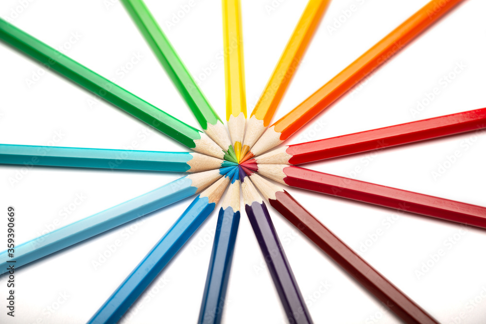 A lot of colorful wooden pencils on a white background
