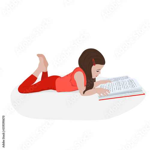 Little girl reads a book and is lying. Distance learning. Home education. School girl girl doing homework. Child with a book in her hands. Bookcrossing.