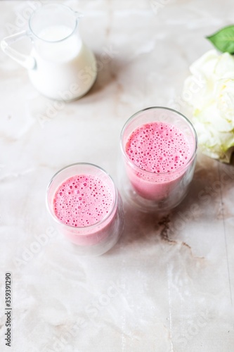 Strawberry cocktails, flowers and milk