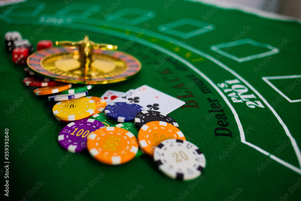 Casino equipment placed on the green floor for risky gambling for the people who want to get rich. Casino equipment placed on the green floor for risky gambling for the people who want to get rich.