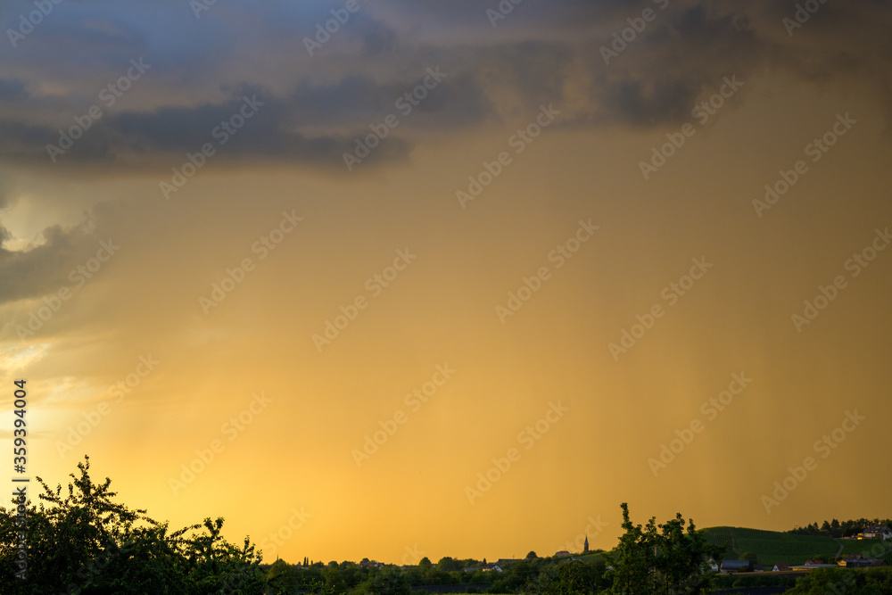 Diffuse colorful orange sunset over countryside