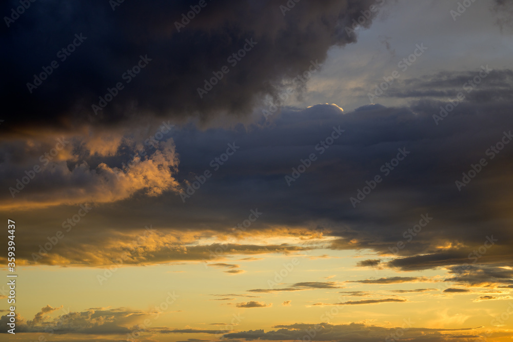 Colourful orange sunset in a cloudy sky Colourful orange sunset in a cloudy sky