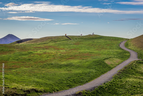 Tourist path in Skutustadagigar pseudocraters area in Iceland photo