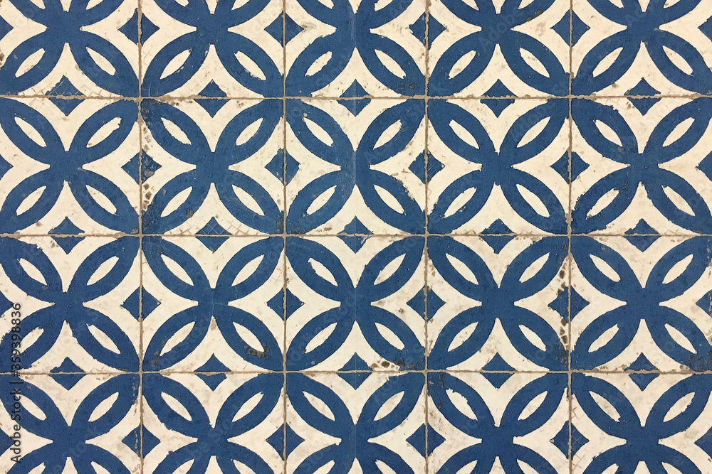 Old  worn blue and white decorated tiles.