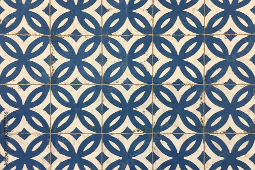 Fotografie Old  worn blue and white decorated tiles.