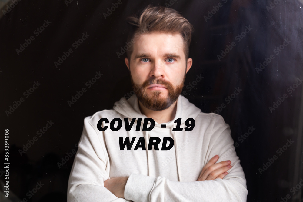Fototapeta premium Hospital quarantine or isolation of patient standing alone in room with hopeful for treatment of Coronavirus COVID-19 Pandemic, Outbreak Efforts prevent virus spreading hazard controls concept.