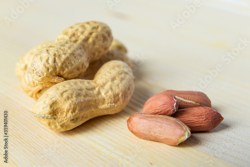 Peanuts on a wooden surface