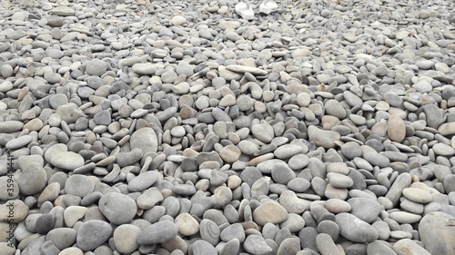 sea beach was completely covered with large stones and pebbles