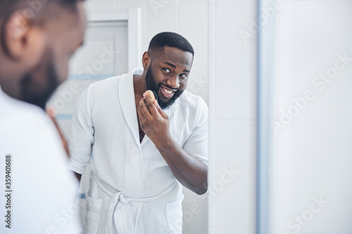 Portrait of handsome male person that posing on camera