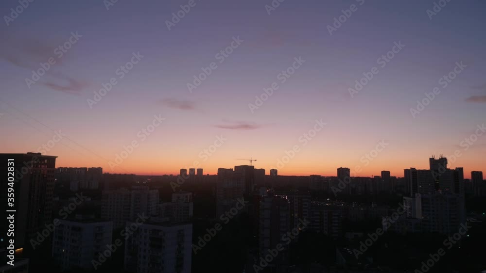 View of colourful dawn over a sleeping area of a big city. View of colourful dawn over a sleeping area of a big city.