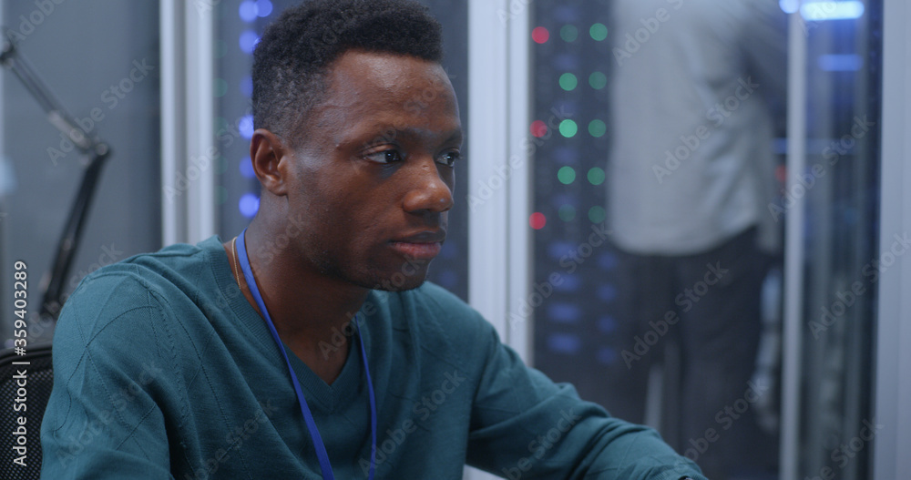 Young man working in data center Young man working in data center